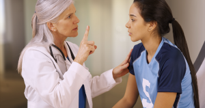 An athlete seeing a doctor for a head injury. TryMunity.